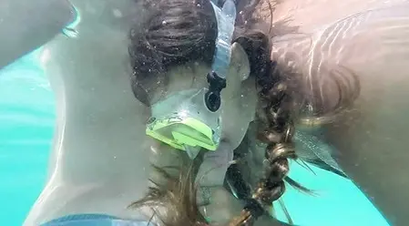 A nimble lover makes a blowjob to a friend in the fresh air and under water